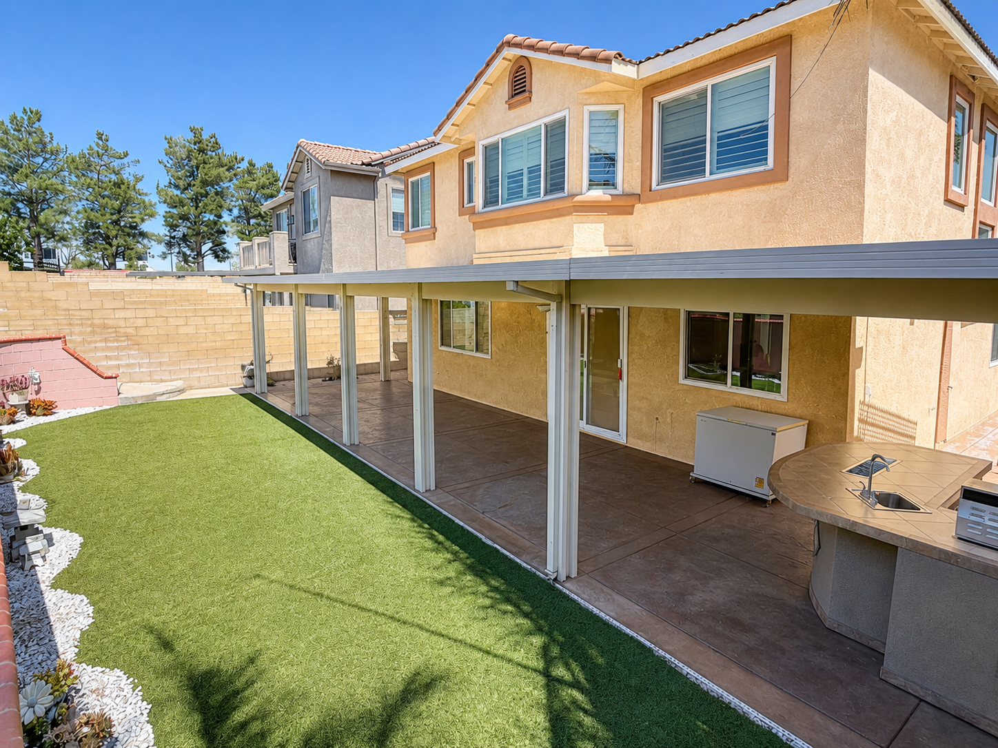 Full-width covered patio running the length of the house