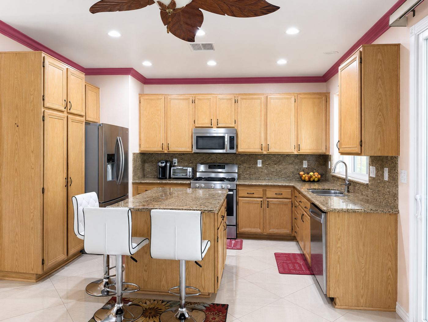 Kitchen with granite counters, full granite backsplash, and center island with bar seating